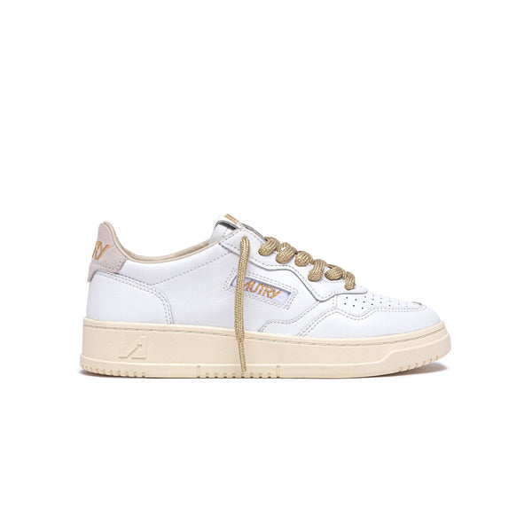 sneakers autry medalist blanches et dorées femmes vue de profil