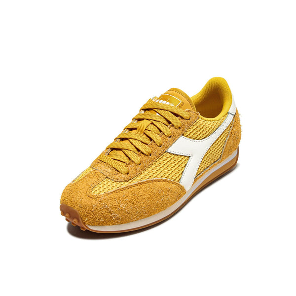  Three-quarter view of Diadora Rally Yellow lifestyle sneakers blending vintage running style and vibrant color
