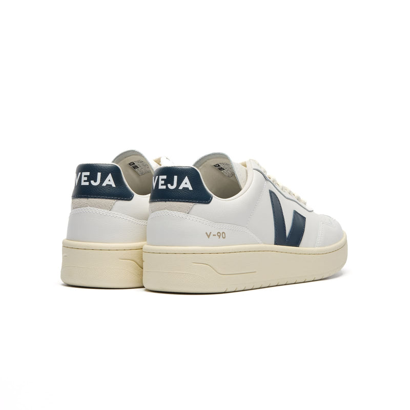 Back view of VEJA V-90 white and blue shoes with heel logo detail
