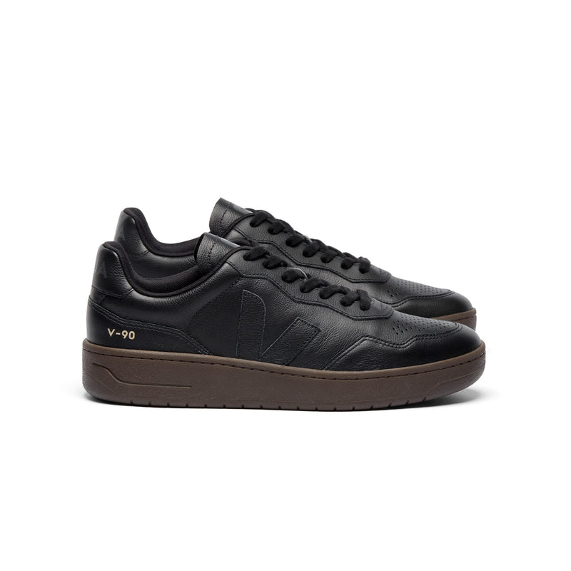 Side view of sustainable VEJA V-90 O.T. Leather sneakers in full black and eagle for men and women