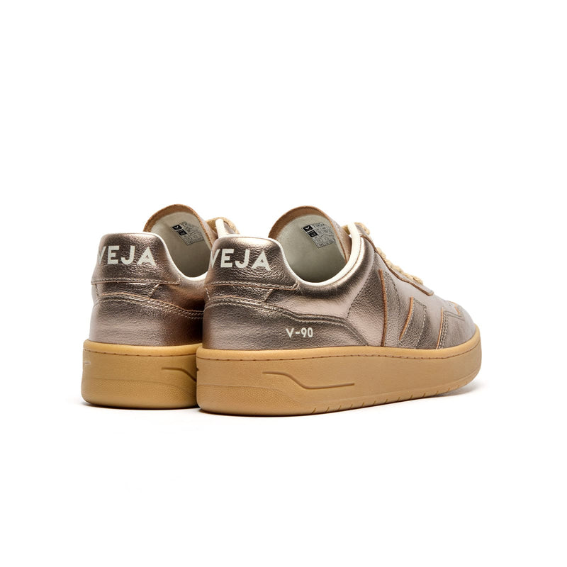 Back view of VEJA V-90 O.T. Leather women’s sneakers with glossy bronze finish and heel logo